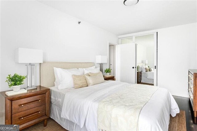 620 Peachtree St NE Unit 1206, Atlanta, GA 30308 - bedroom with wood finished floors and a closet