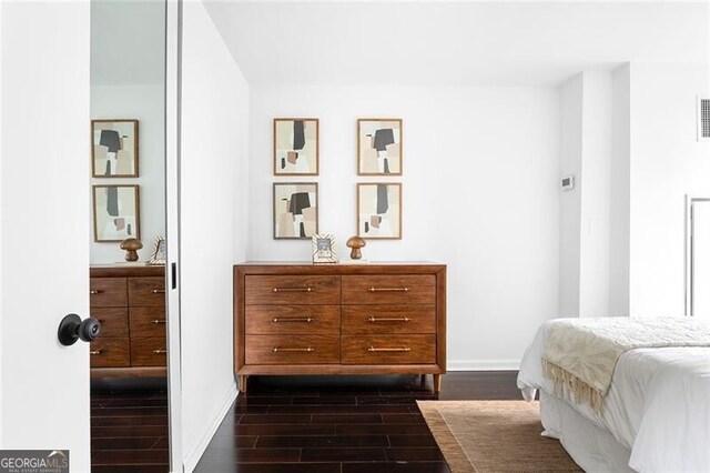 620 Peachtree St NE Unit 1206, Atlanta, GA 30308 - bedroom with dark wood-type flooring and baseboards