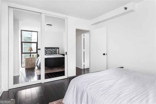 620 Peachtree St NE Unit 1206, Atlanta, GA 30308 - bedroom with dark wood-type flooring
