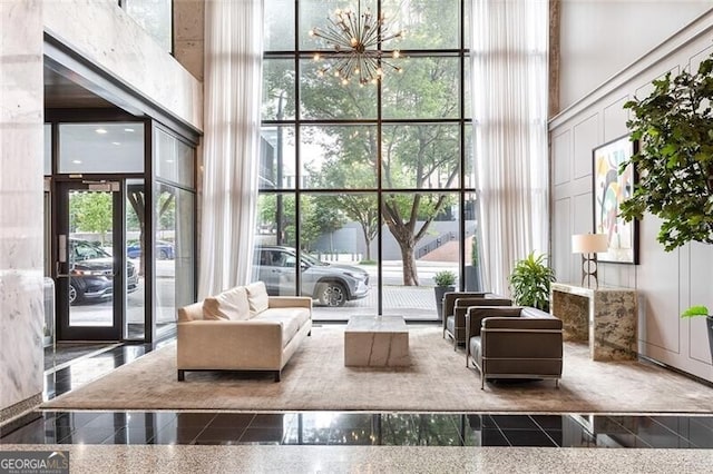 620 Peachtree St NE Unit 1206, Atlanta, GA 30308 - lobby featuring a high ceiling and a wall of windows