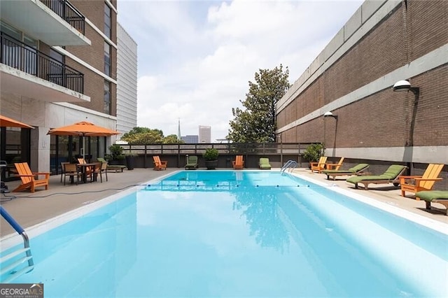 620 Peachtree St NE Unit 1206, Atlanta, GA 30308 - community pool featuring a patio