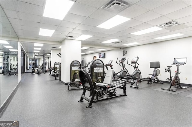 620 Peachtree St NE Unit 1206, Atlanta, GA 30308 - gym with a paneled ceiling and baseboards