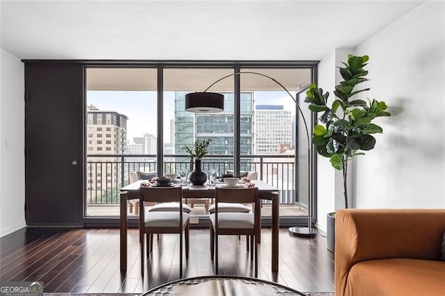 620 Peachtree St NE Unit 1206, Atlanta, GA 30308 - dining room with floor to ceiling windows, plenty of natural light, wood finished floors, and a city view