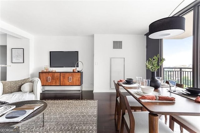 620 Peachtree St NE Unit 1206, Atlanta, GA 30308 - living room with dark wood finished floors and expansive windows