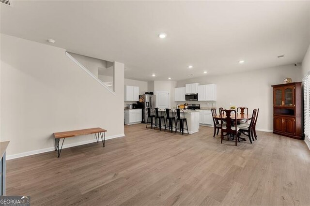 352 Walnut Grove Way, Pendergrass, GA 30567 - dining room with light wood-style flooring, recessed lighting, and baseboards