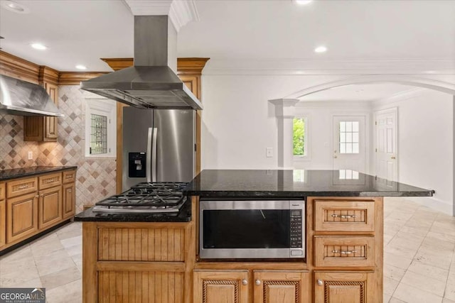 6771 Sunny Brook Ln, Atlanta, GA 30328 - kitchen with appliances with stainless steel finishes, island range hood, arched walkways, ornamental molding, and a kitchen island