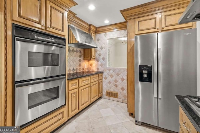 6771 Sunny Brook Ln, Atlanta, GA 30328 - kitchen featuring stainless steel appliances, wall chimney exhaust hood, light tile patterned floors, dark stone counters, and tile walls