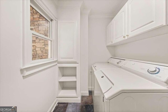 6771 Sunny Brook Ln, Atlanta, GA 30328 - laundry area featuring washing machine and clothes dryer, cabinet space, and ornamental molding