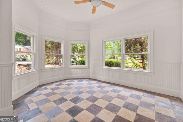 6771 Sunny Brook Ln, Atlanta, GA 30328 - empty room featuring a ceiling fan and a wainscoted wall