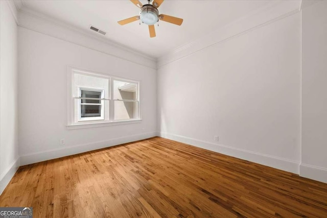 6771 Sunny Brook Ln, Atlanta, GA 30328 - spare room with crown molding, light wood-style floors, and ceiling fan