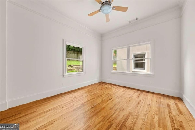 6771 Sunny Brook Ln, Atlanta, GA 30328 - empty room featuring ornamental molding, light wood-style floors, and a ceiling fan