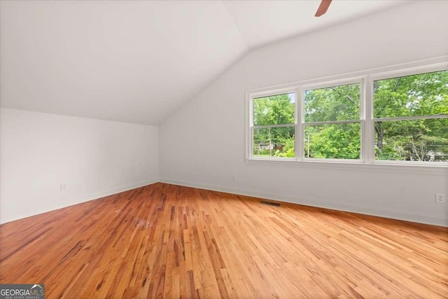 6771 Sunny Brook Ln, Atlanta, GA 30328 - bonus room featuring lofted ceiling, light wood finished floors, and a ceiling fan