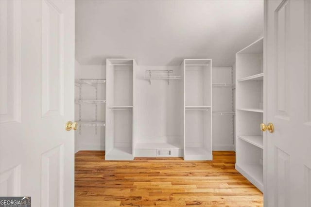 6771 Sunny Brook Ln, Atlanta, GA 30328 - spacious closet featuring wood finished floors