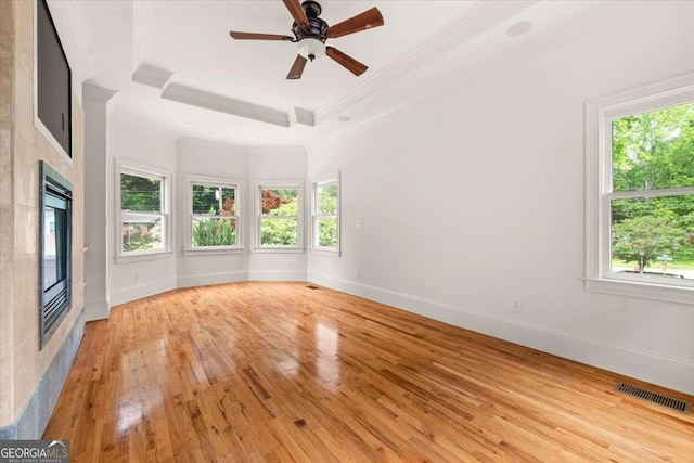 6771 Sunny Brook Ln, Atlanta, GA 30328 - unfurnished room featuring ornamental molding, plenty of natural light, light wood finished floors, and a ceiling fan