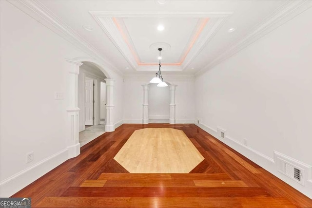 6771 Sunny Brook Ln, Atlanta, GA 30328 - spare room with crown molding, arched walkways, a raised ceiling, and wood finished floors