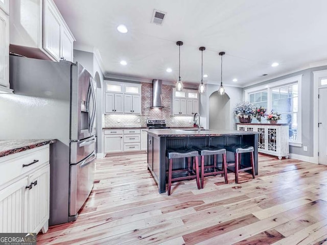 4454 Damascus Rd, Jasper, GA 30143 - kitchen featuring wall chimney range hood, stainless steel refrigerator with ice dispenser, electric stove, arched walkways, and crown molding