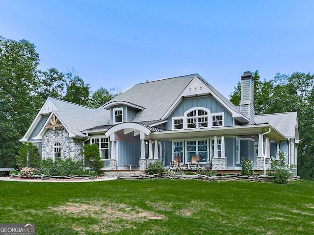 4454 Damascus Rd, Jasper, GA 30143 - view of front facade with a chimney, a front yard, covered porch, and stone siding