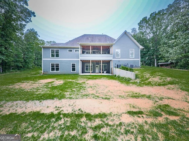 4454 Damascus Rd, Jasper, GA 30143 - back of house featuring a sunroom, a patio, a lawn, and central air condition unit