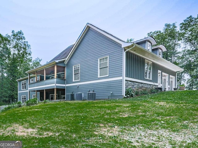 4454 Damascus Rd, Jasper, GA 30143 - back of house featuring cooling unit, board and batten siding, and a lawn