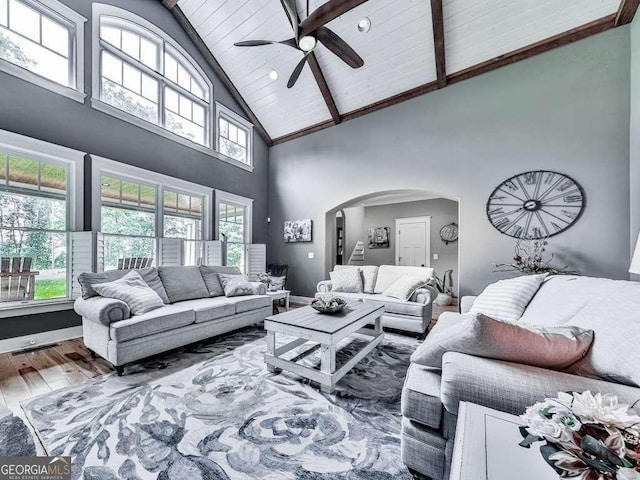 4454 Damascus Rd, Jasper, GA 30143 - living room featuring arched walkways, high vaulted ceiling, ceiling fan, wood finished floors, and wood ceiling with exposed beams