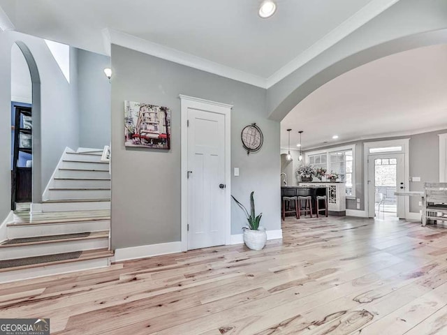 4454 Damascus Rd, Jasper, GA 30143 - entrance foyer featuring arched walkways, wood finished floors, crown molding, baseboards, and recessed lighting