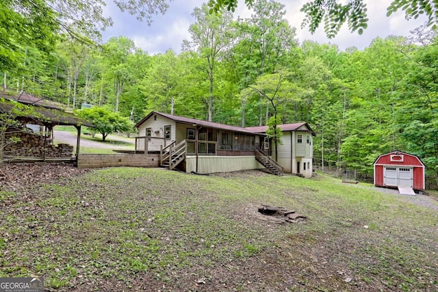 4618 Jones Gap Rd, Hiawassee, GA 30546 - ranch-style house with stairway, a forest view, covered porch, and a garage
