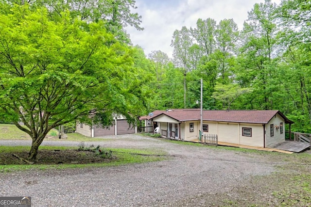 4618 Jones Gap Rd, Hiawassee, GA 30546 - ranch-style house with dirt driveway and a wooden deck