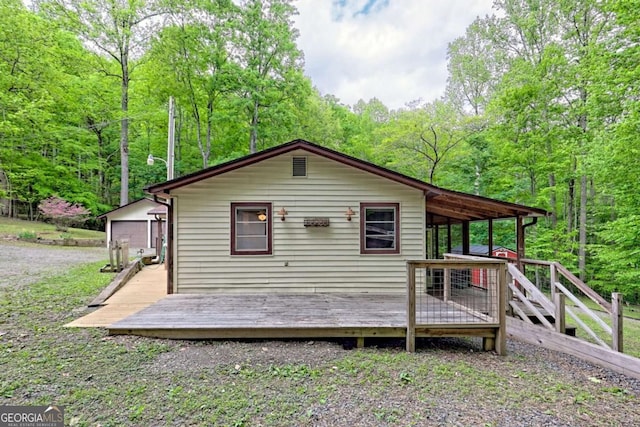 4618 Jones Gap Rd, Hiawassee, GA 30546 - rear view of house featuring a deck and a wooded view