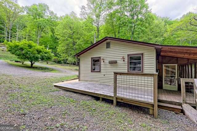 4618 Jones Gap Rd, Hiawassee, GA 30546 - view of side of home with a deck and a view of trees