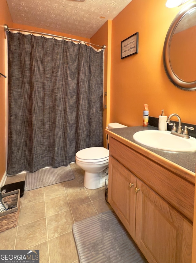 50 Kensington Dr, Cleveland, GA 30528 - bathroom with vanity, tile patterned flooring, toilet, a textured ceiling, and a shower with curtain