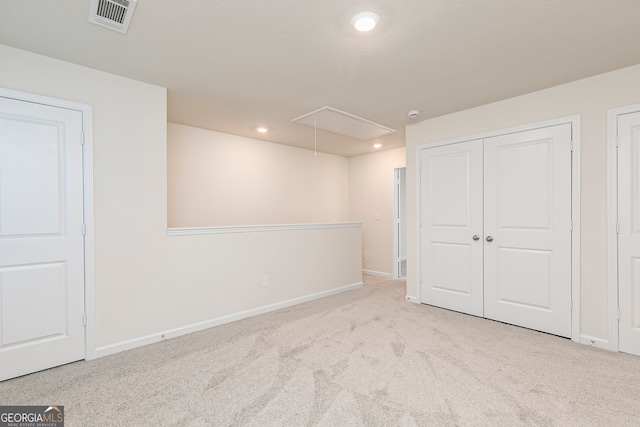 295 Limestone Cir, Conyers, GA 30013 - unfurnished bedroom with attic access, carpet, baseboards, recessed lighting, and a closet