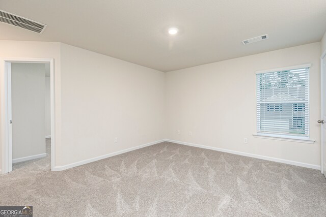295 Limestone Cir, Conyers, GA 30013 - carpeted empty room with baseboards and recessed lighting