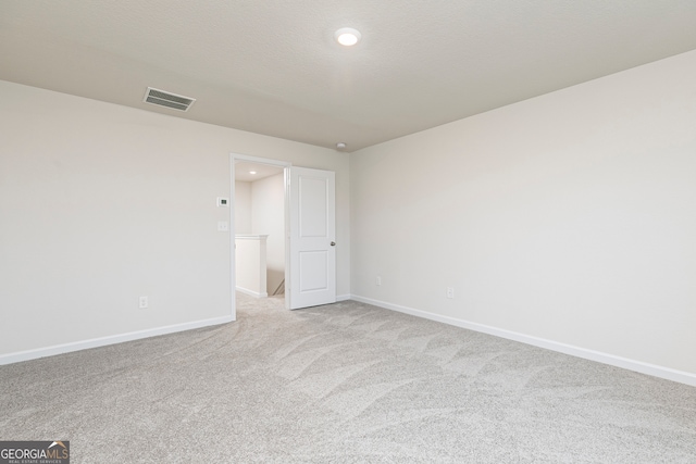 295 Limestone Cir, Conyers, GA 30013 - spare room with light colored carpet, baseboards, and recessed lighting