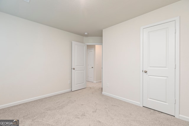 295 Limestone Cir, Conyers, GA 30013 - unfurnished bedroom with carpet floors and baseboards