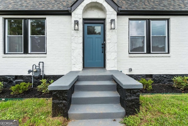 1283 Beecher St SW, Atlanta, GA 30310 - view of exterior entry with brick siding and a shingled roof