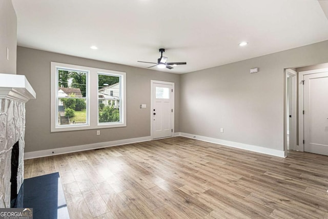 1283 Beecher St SW, Atlanta, GA 30310 - unfurnished living room featuring ceiling fan, a fireplace, wood finished floors, and recessed lighting