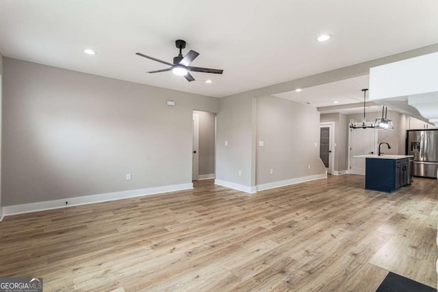 1283 Beecher St SW, Atlanta, GA 30310 - unfurnished living room featuring a ceiling fan, light wood-style flooring, and recessed lighting