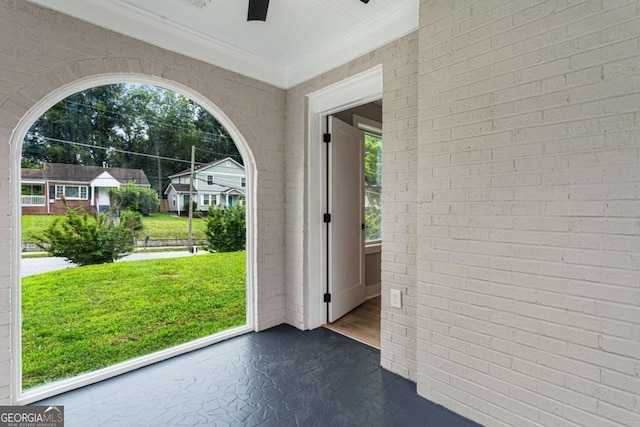 1283 Beecher St SW, Atlanta, GA 30310 - doorway with a ceiling fan, crown molding, dark wood finished floors, and brick wall