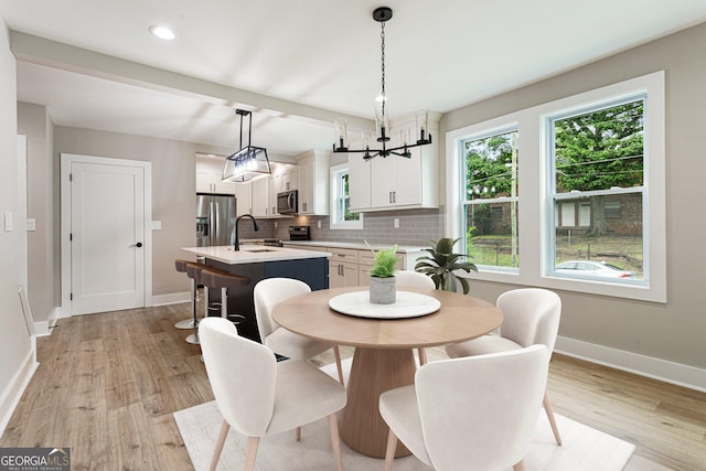 1283 Beecher St SW, Atlanta, GA 30310 - dining room featuring healthy amount of natural light, light wood finished floors, a chandelier, and recessed lighting