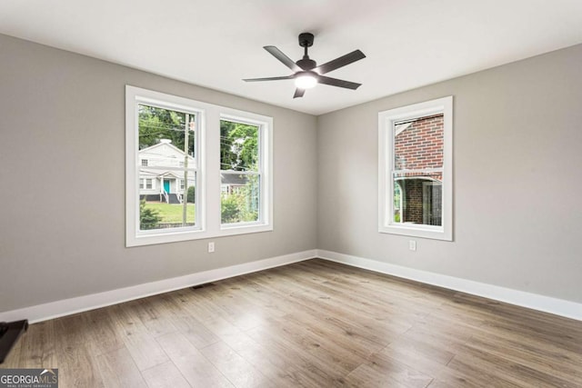 1283 Beecher St SW, Atlanta, GA 30310 - empty room with wood finished floors and a ceiling fan