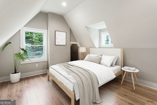 1283 Beecher St SW, Atlanta, GA 30310 - bedroom featuring multiple windows, lofted ceiling, and wood finished floors