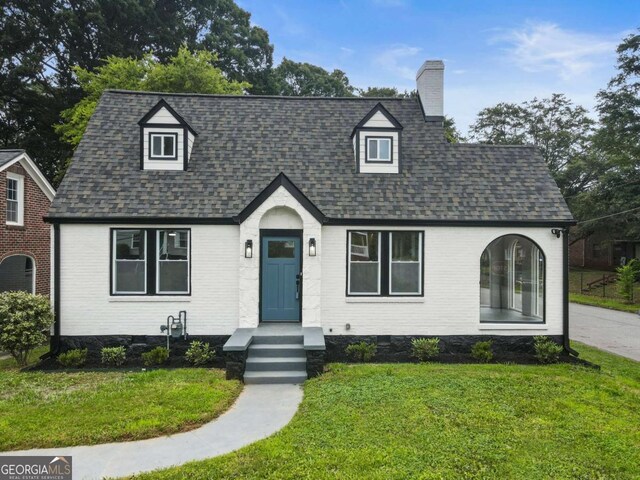 1283 Beecher St SW, Atlanta, GA 30310 - view of front of property featuring a chimney, brick siding, a front yard, and a shingled roof
