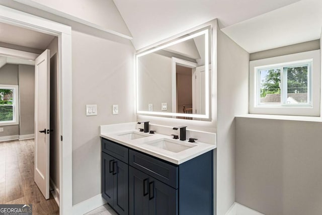 1283 Beecher St SW, Atlanta, GA 30310 - full bathroom with lofted ceiling, double vanity, and wood finished floors