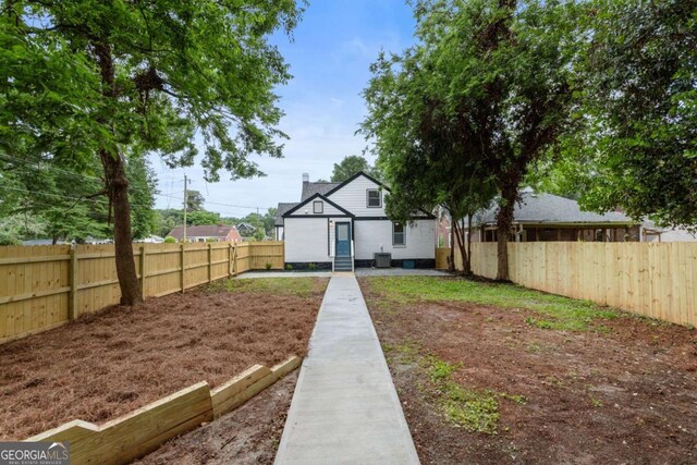 1283 Beecher St SW, Atlanta, GA 30310 - rear view of property with a fenced backyard and a chimney