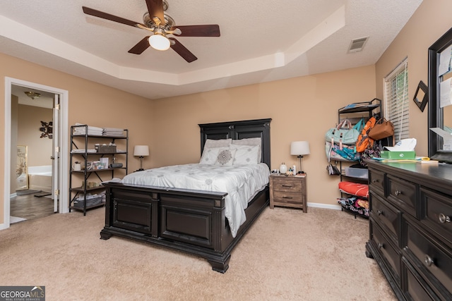 205 Carver Ct, Warner Robins, GA 31088 - bedroom featuring light colored carpet, a tray ceiling, baseboards, and ceiling fan