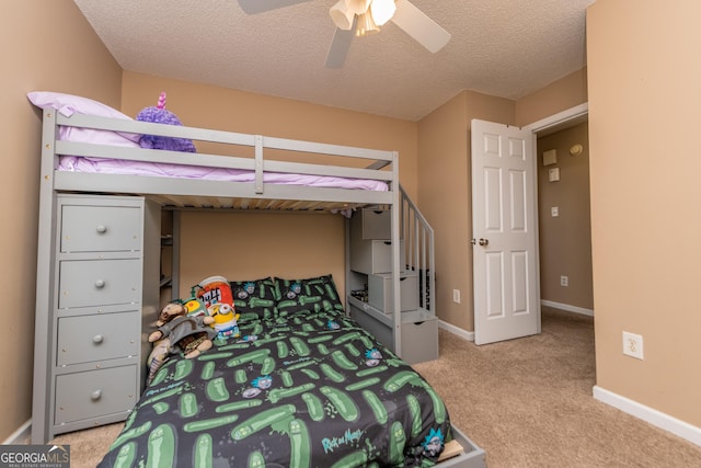 205 Carver Ct, Warner Robins, GA 31088 - bedroom featuring carpet, baseboards, a ceiling fan, and a textured ceiling