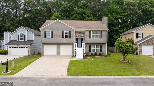 1087 Berkley Dr SE, Smyrna, GA 30082 - split foyer home featuring a garage, concrete driveway, a chimney, and view of wooded area