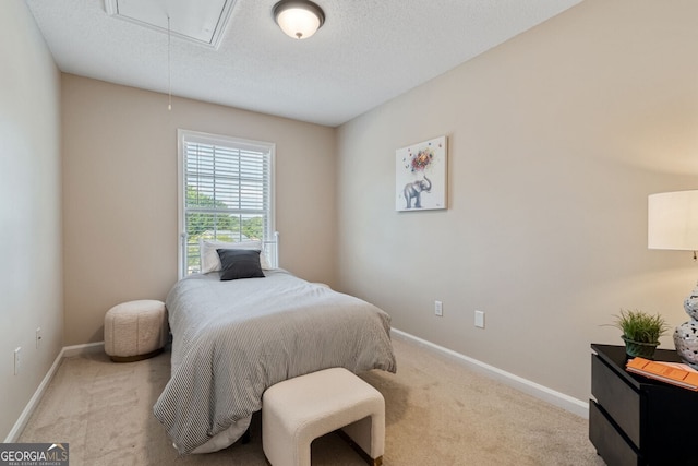 1087 Berkley Dr SE, Smyrna, GA 30082 - carpeted bedroom featuring attic access, baseboards, and a textured ceiling
