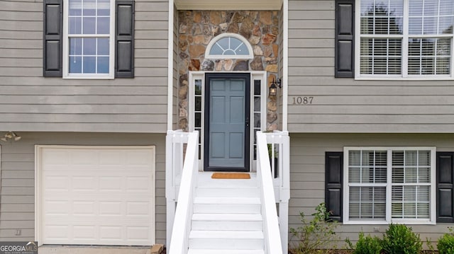 1087 Berkley Dr SE, Smyrna, GA 30082 - entrance to property with stone siding and an attached garage