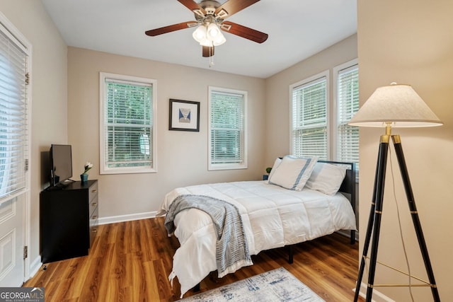 1087 Berkley Dr SE, Smyrna, GA 30082 - bedroom featuring wood finished floors, baseboards, and ceiling fan